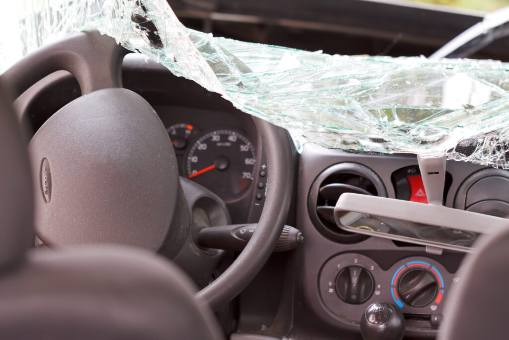 Interior view of a smashed car's windshield after the accident