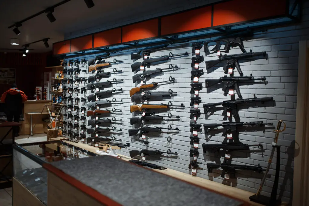 Gun shop with a lot off firearms on the wall