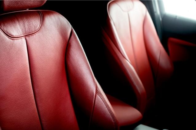 Red leather front seats on a sport car. 